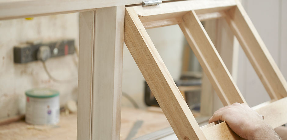 Carpenter Assembling Newly Made Windows