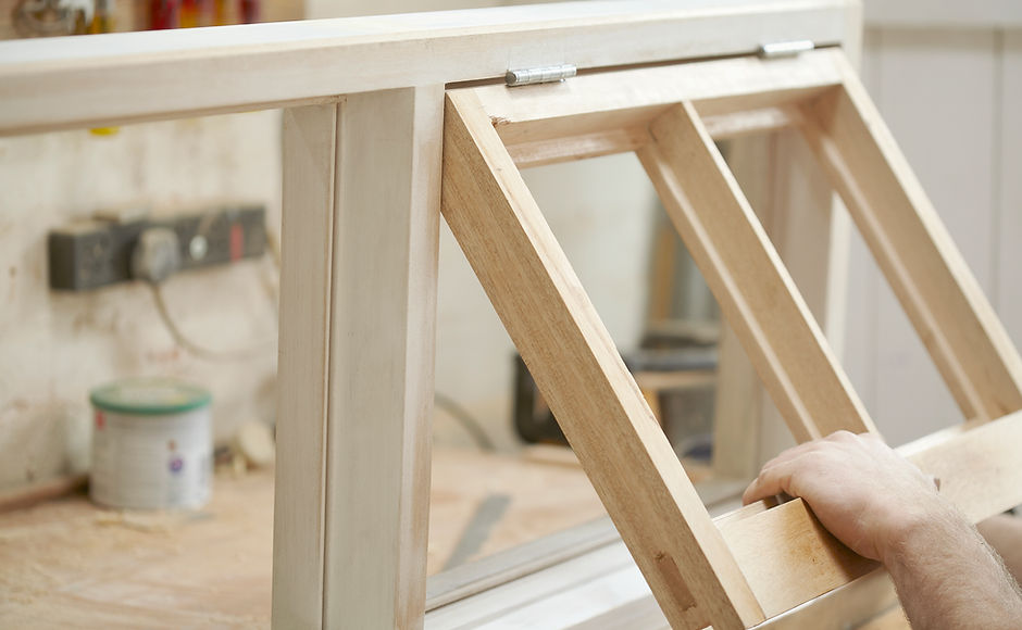Carpenter Assembling Newly Made Windows