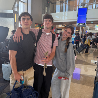 Sam Fegan, Lennon Sutphin and Savannah Whalen (me) smiling at the airport in a group photo