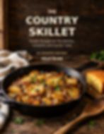 The Country Skillet cookbook cover by Milo Alan, featuring a cast iron skillet of fried potatoes beside cornbread.