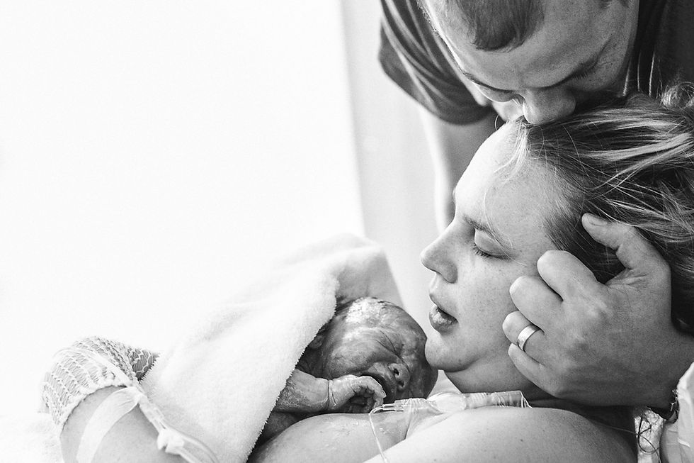 Husband kissing wife photographed by Sydney Birth Photographer de lumiere photography