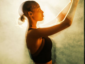 Women moving in smoky background