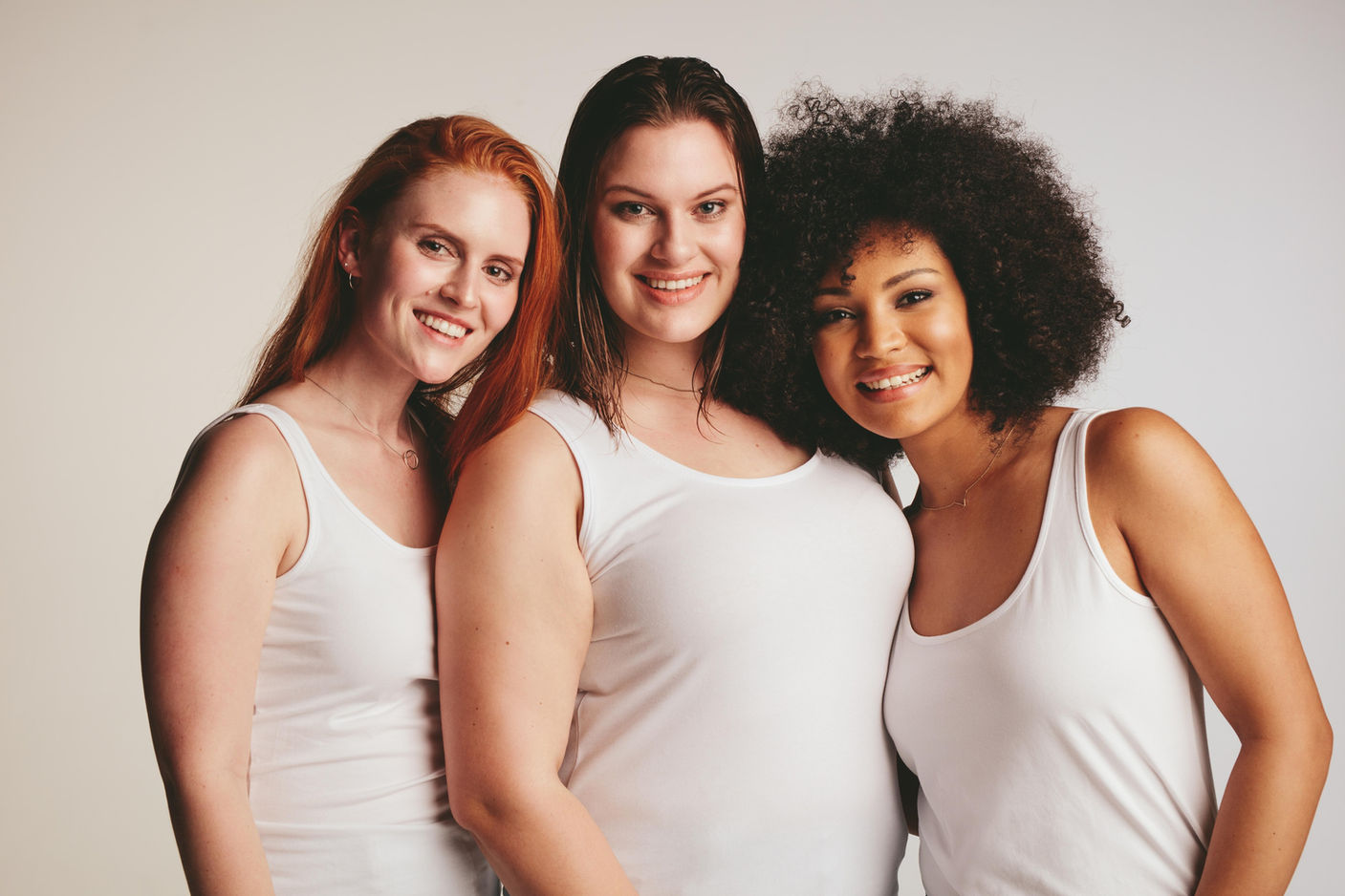 np_Group of diverse models wearing tank tops against light colored background_5p9Wv4_large