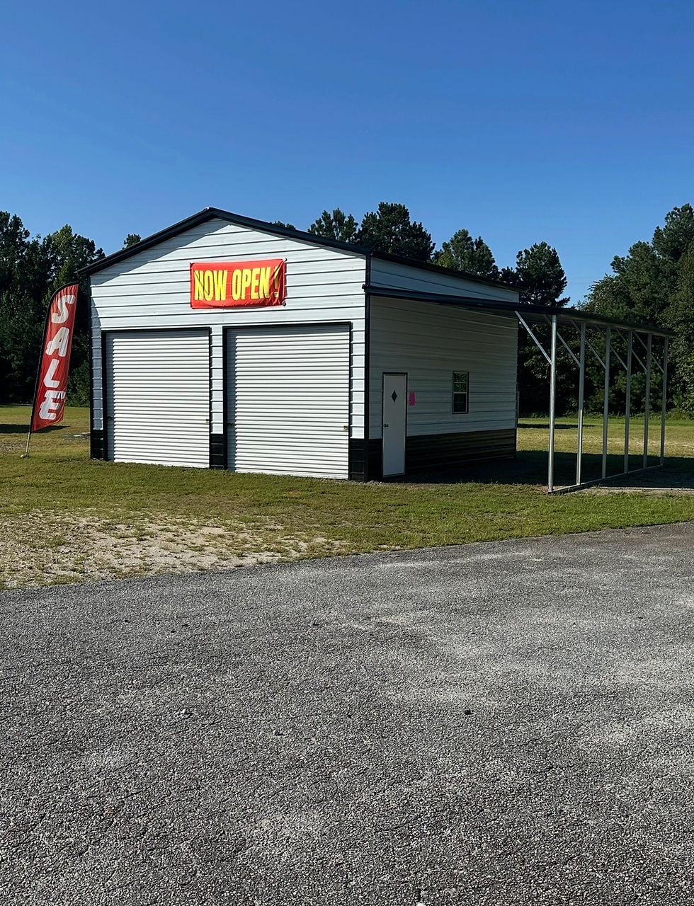 Garages with two roll-up doors and lean to.