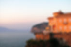 a building sitting on top of a cliff next to the ocean_edited.jpg