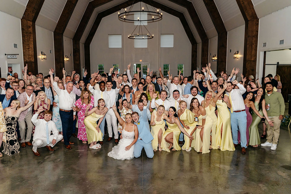 Guests celebrating during the wedding reception at Stone Briar Farm.