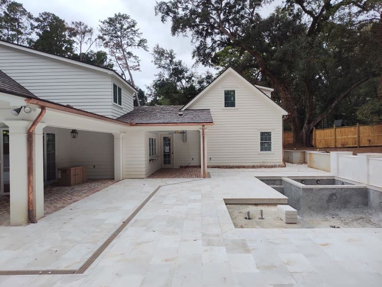 backyard of home under construction with new pool area