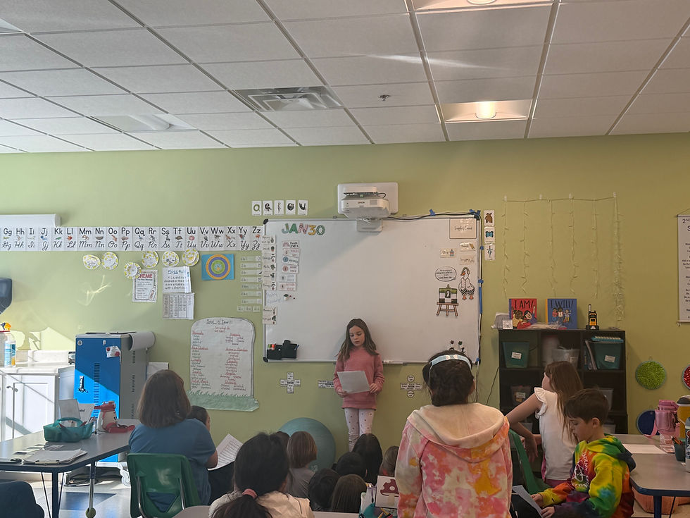 An elementary school student reciting poetry