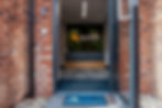 Zenith office entrance with open door and logo