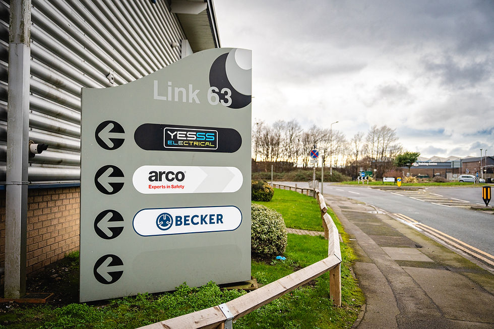 Directional sign Link 63 shows YESS Electrical, arco, BECKER logos.