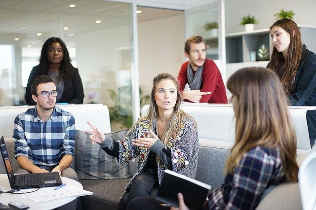 A client communicating with a team of professionals, representing crucial things to tell your web designer.