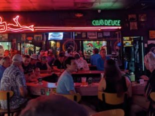 Interior of Mac's Club Deuce with Patrons credit Islander News.