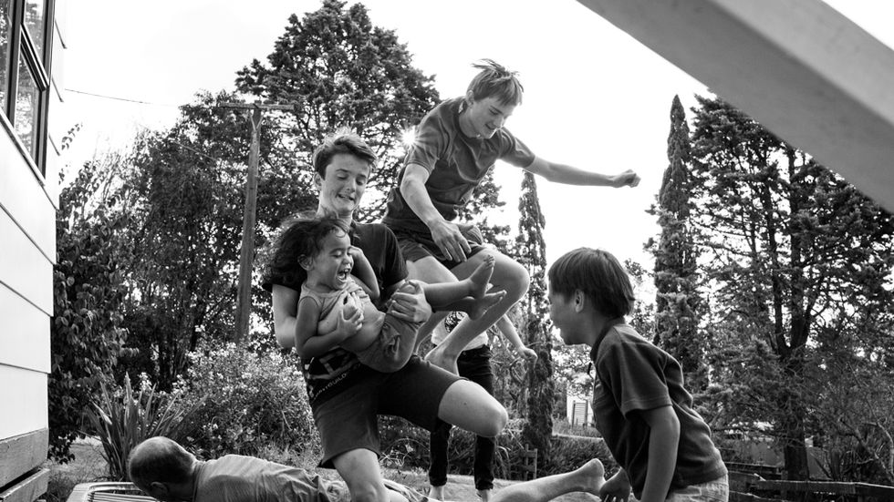 family jumping on a trampoline