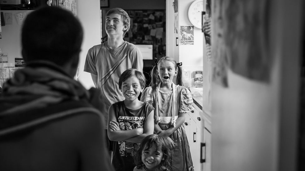 a boy shaves off his hair and everyone watches