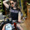 Thumbnail: Woman on Motorcycle Wearing a Ton-Up Chequerbelter Women's Black Tee 
