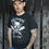 Thumbnail: Lee Johnston Wearing Red Torpedo Patriot Men's Black Tee Showing Front Design