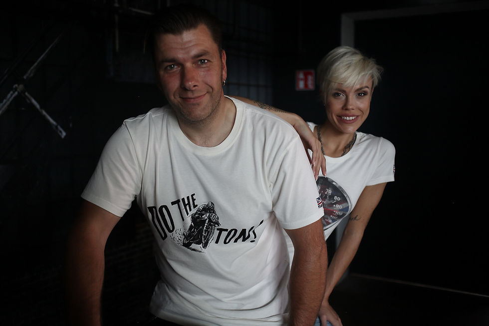 Man and Woman on Motorcycle Wearing Ton-Up Clothing 