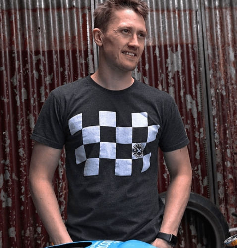 Dean Harrison Wearing Red Torpedo Podium Men's Anthracite Tee Showing Front Design