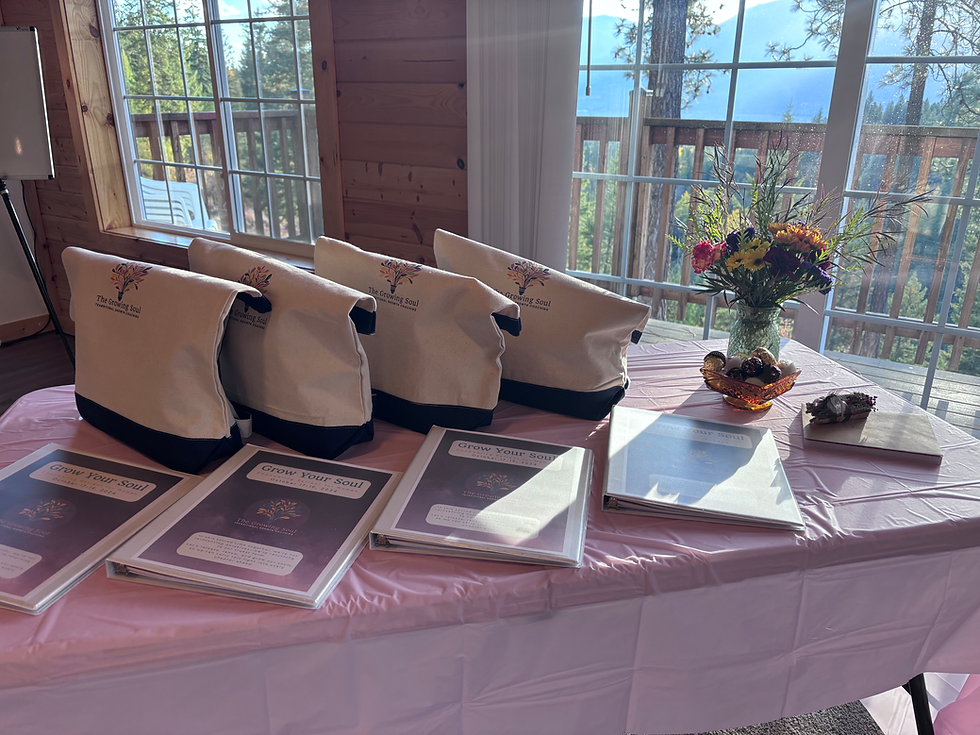 Table with Grow Your Soul swag bags and workbooks