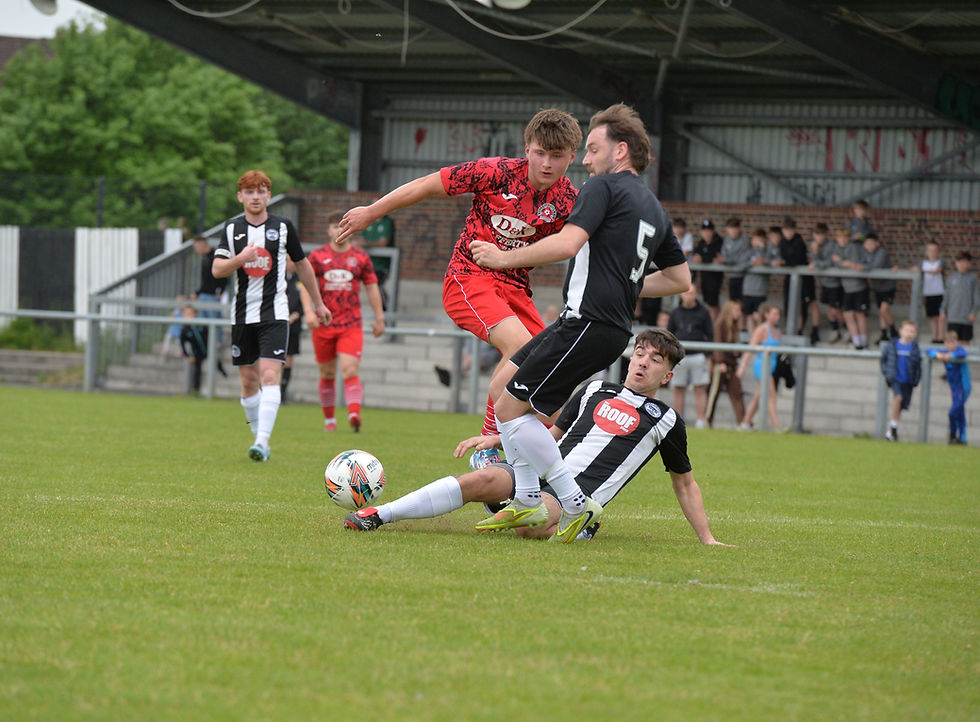 Ryan Waugh slides in to block Kuba Ryszka's shot