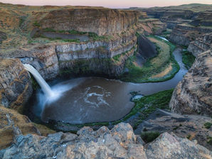 A waterfall feeding into a river