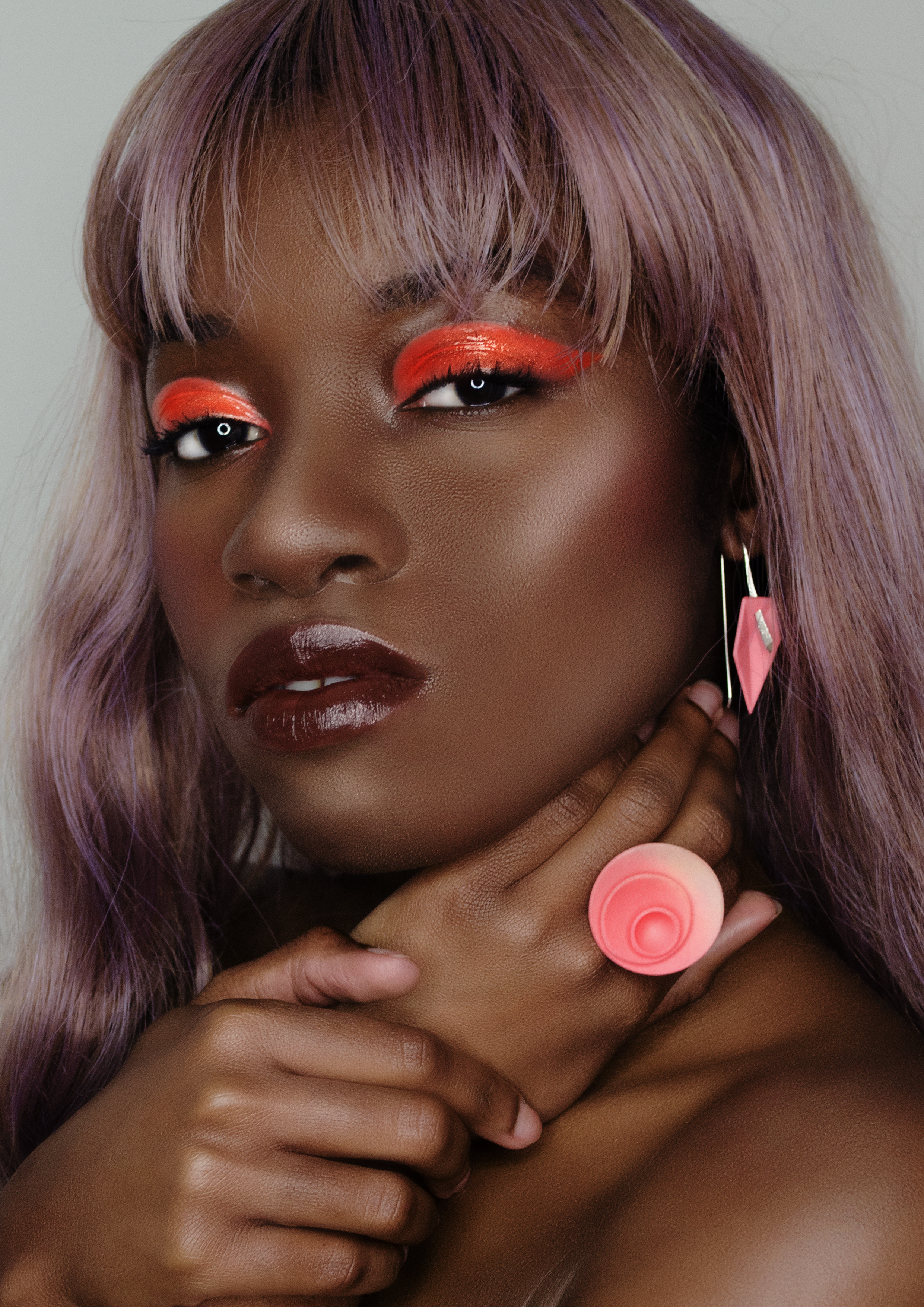 Coral pink accessories on black model