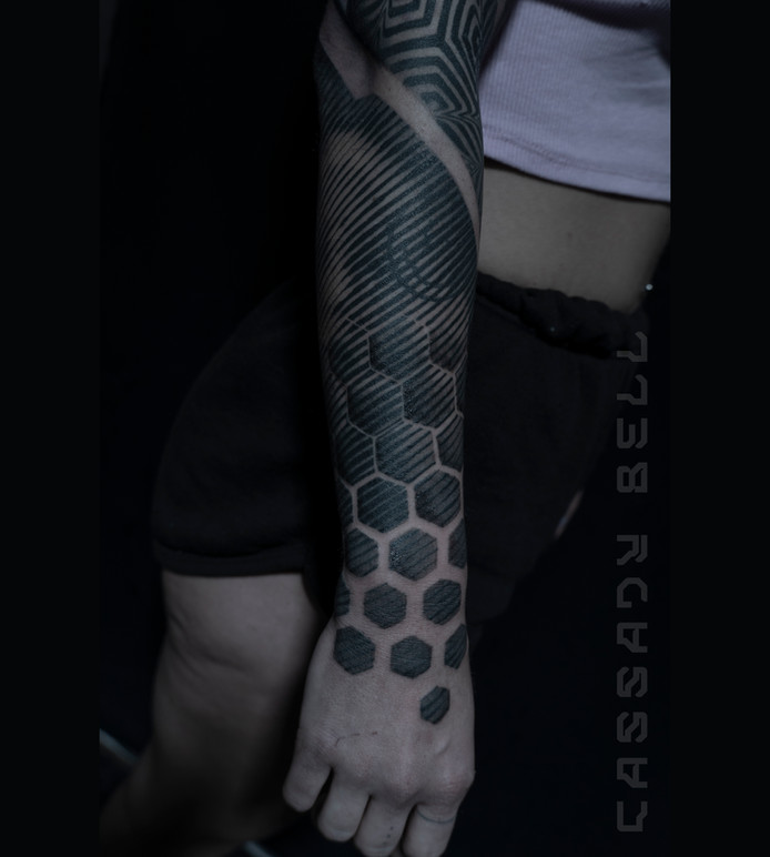 Right fore arm tattoo with black hexagon designs