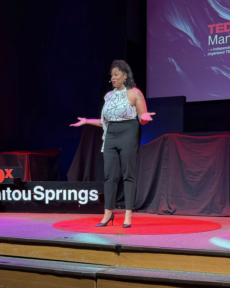 Dr. Arielle Jordan on the red circle at TEDxManitou Springs