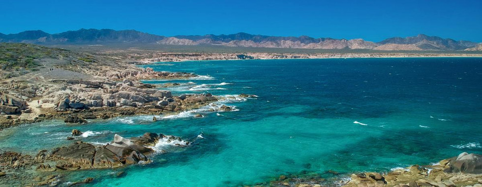 Bay in the East Cape with stunning waters, and rocky shores.