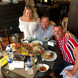 Group of three people enjoying lunch at La Casa Country in Cabo, Mexico.