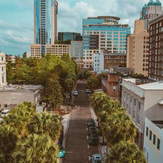 Downtown Orlando, Florida covered in tall buildings and greenery.