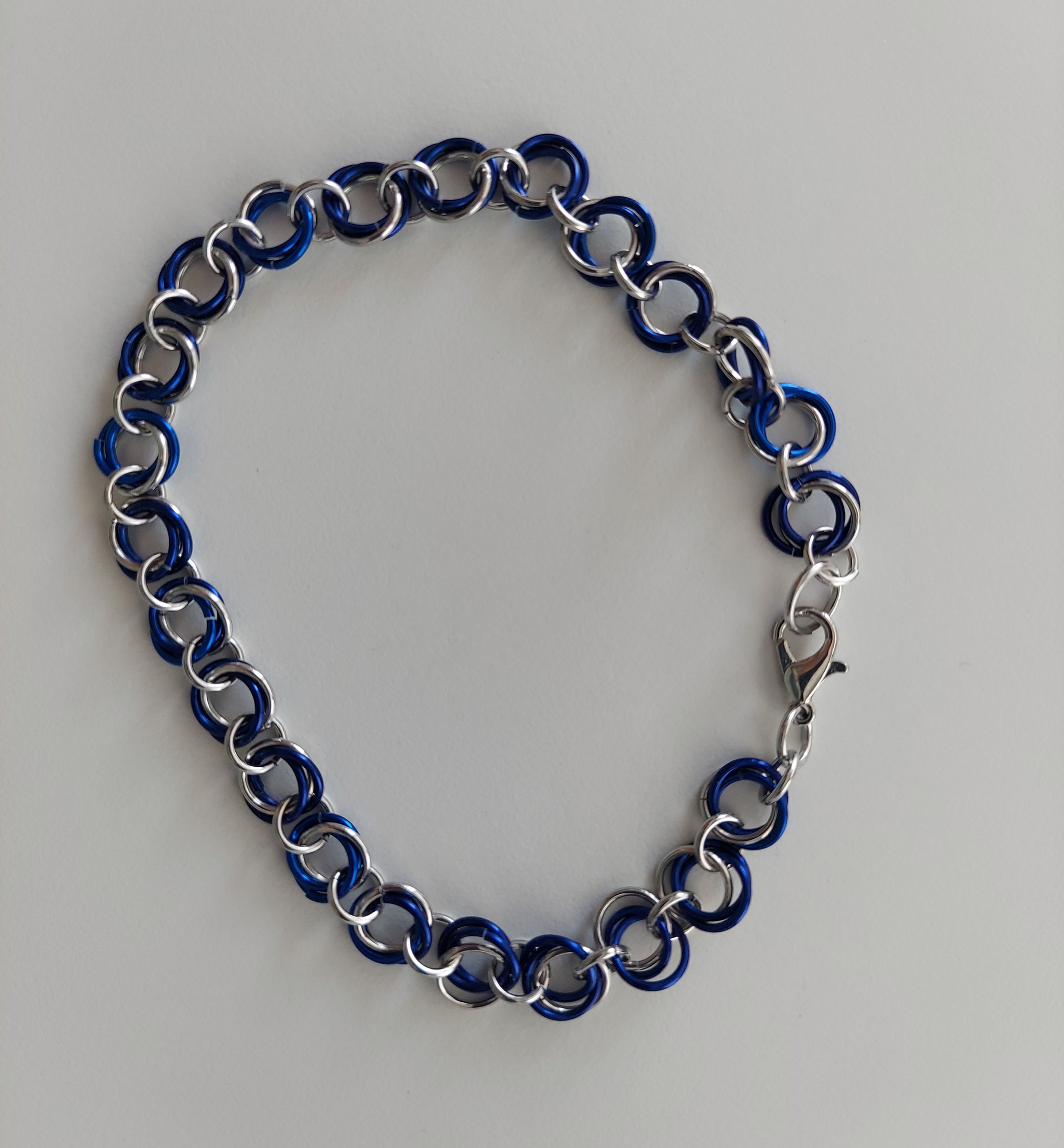 Aluminum Rosette bracelet with navy blue and silver links