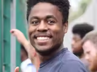 Young male of colour smiling
