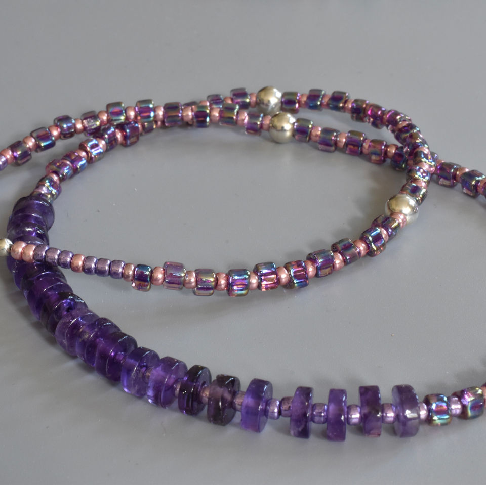 Purple and pink beads with large silver beads and tyre shaped Amethyst gemstones create this lavish looking necklace. 