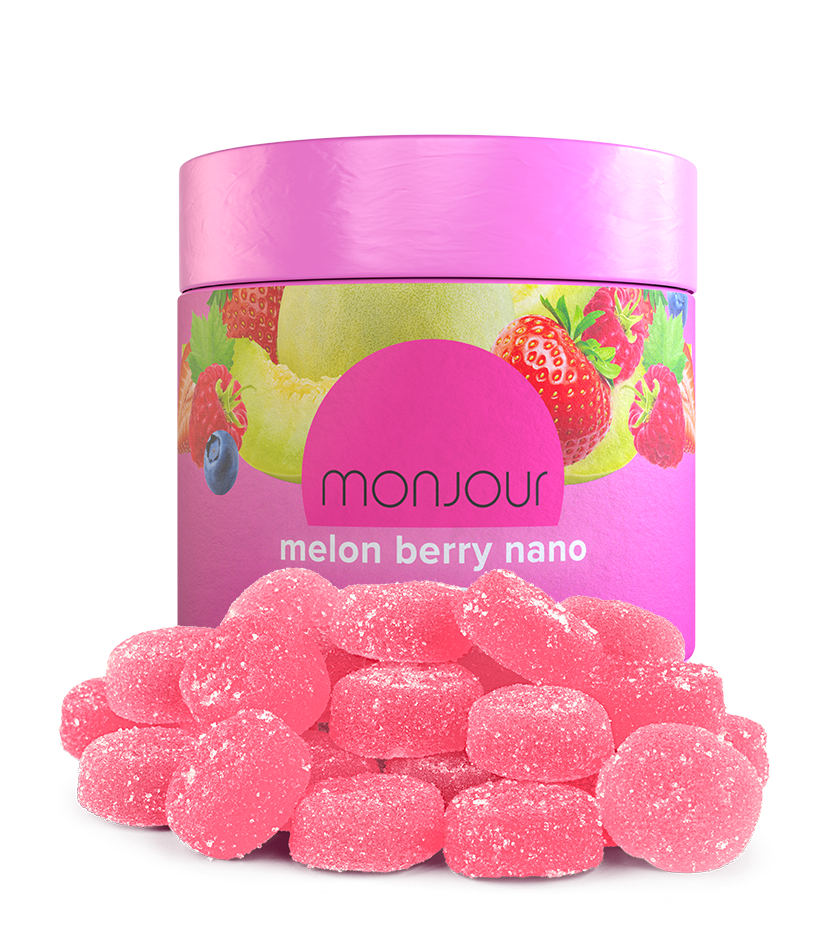A bright pink jar of Monjour Melon Berry Nano with a pile of gummies.