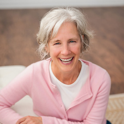 Somersault-Wellness_2000px_pink-sweater-laughing-leaning-on-couch.jpg