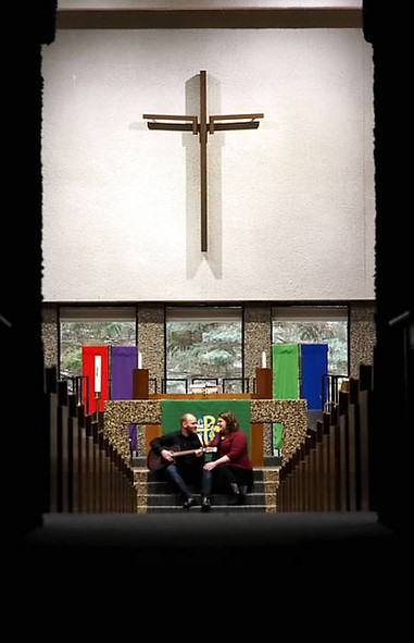OlariPhotography Family Pictures engagement photo in church with cross