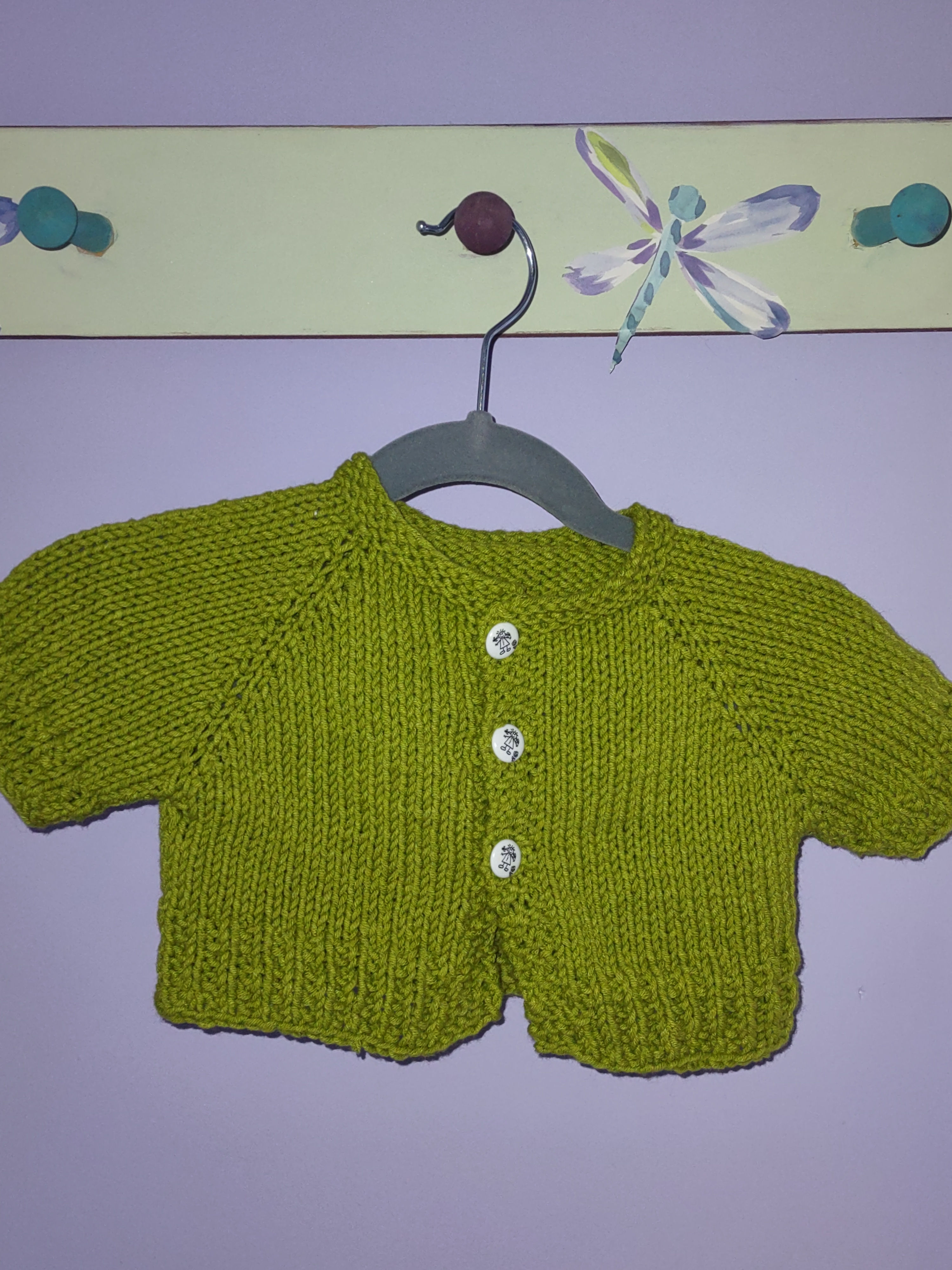 #221 Apple green short sleeve sweater with stick figure buttons