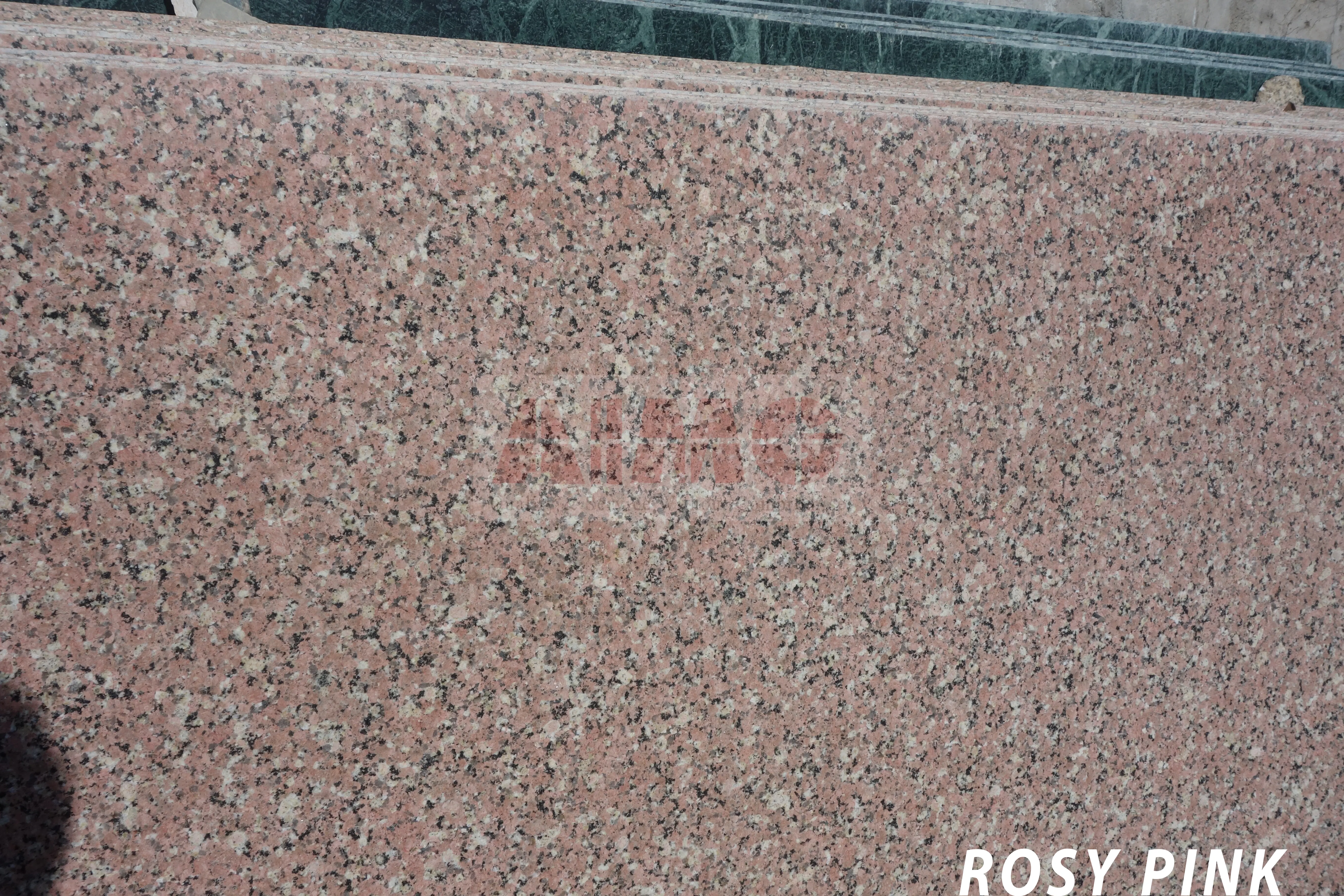 Rosy Pink Granite slab by Aravali Marbles featuring soft pink mineral textures for elegant kitchen countertops and interior applications
