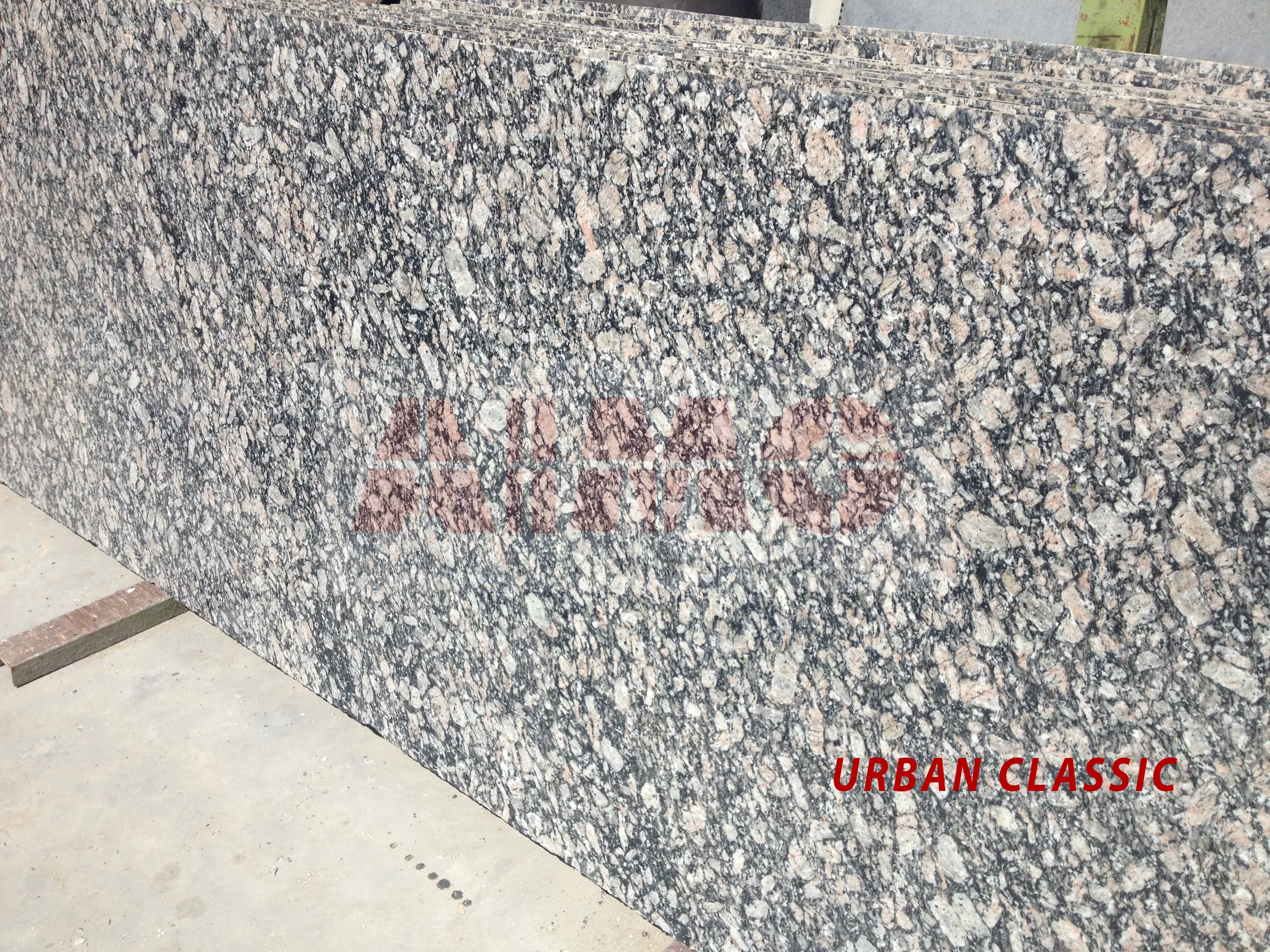 Urban Classic Granite slab by Aravali Marbles showcasing bold black, grey, and pink textures for contemporary kitchen interiors