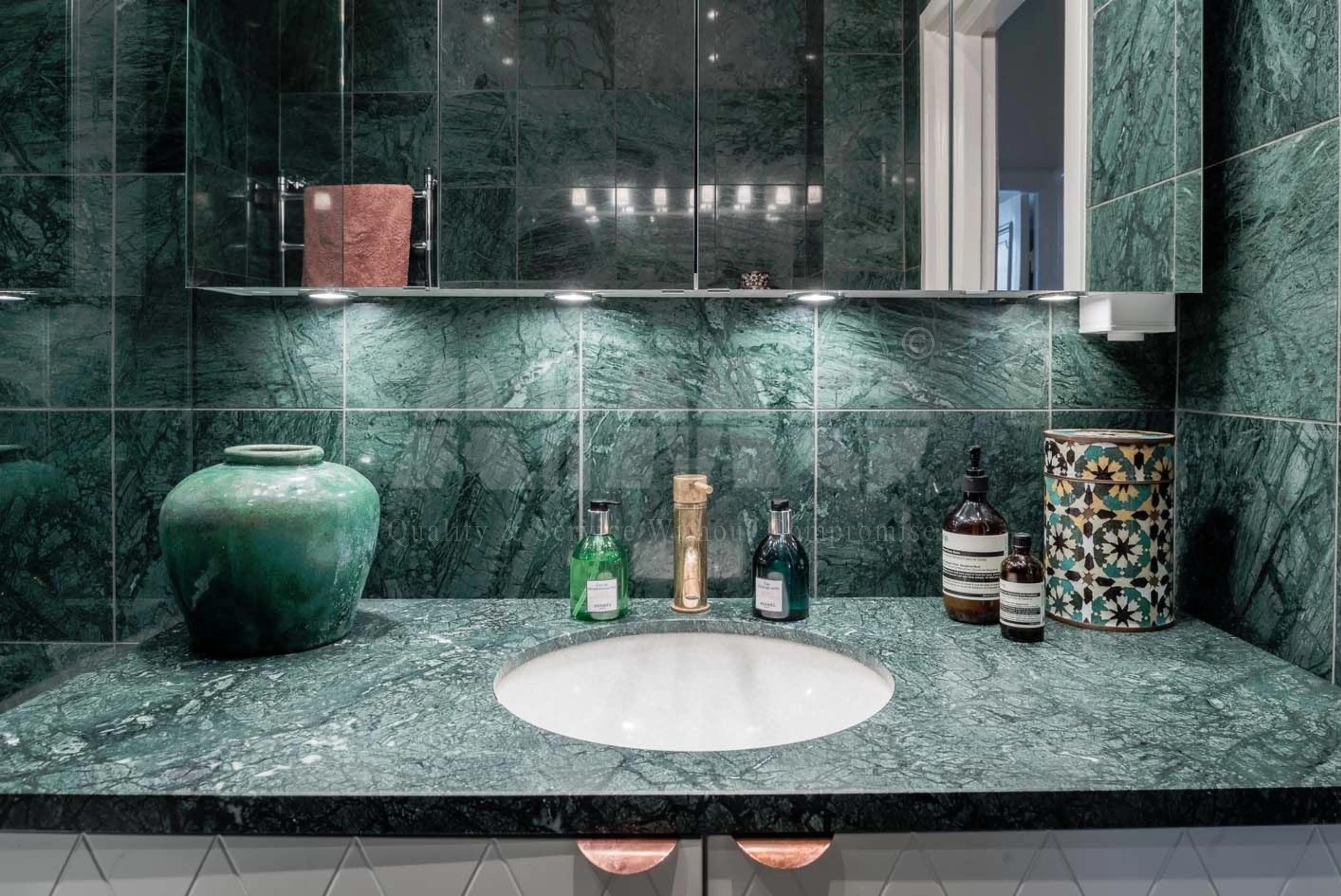 Premium green marble countertop by Aravali Marbles featuring polished emerald-green natural stone with elegant veining for luxury kitchens and bathroom vanities.