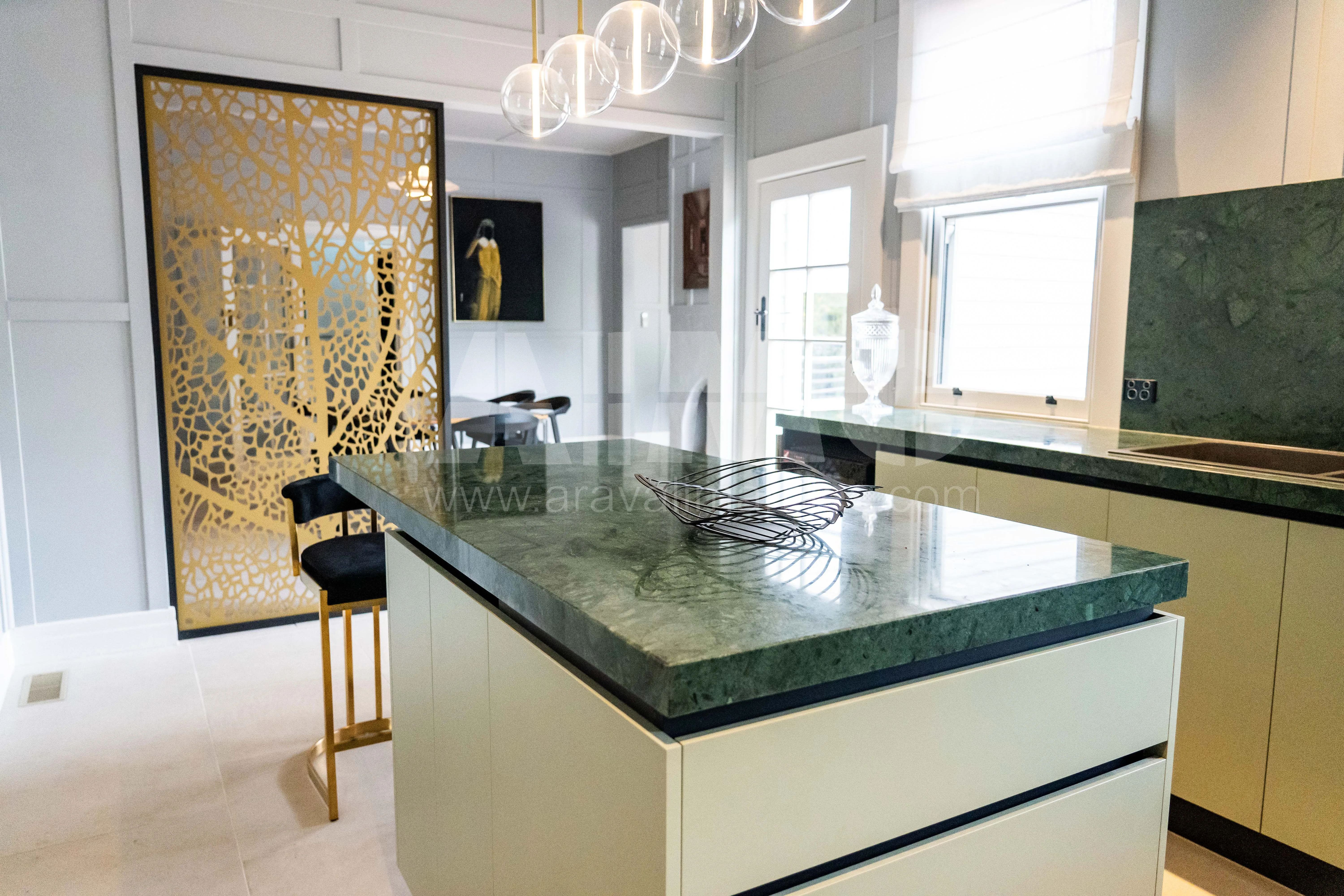 Modern kitchen island with Verde Guatemala Marble by Aravali India Marbles and Greens exporter