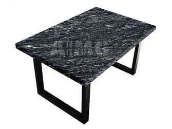 Modern table with a polished Black Markino Granite surface showing distinctive streaked patterns from Aravali India Marbles & Granites.