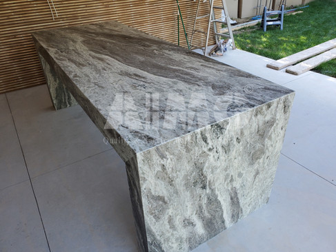 Waterfall dining table crafted from Fantasy Brown Marble by Aravali Marbles, highlighting seamless natural veining and expert stone craftsmanship for luxury interiors.
