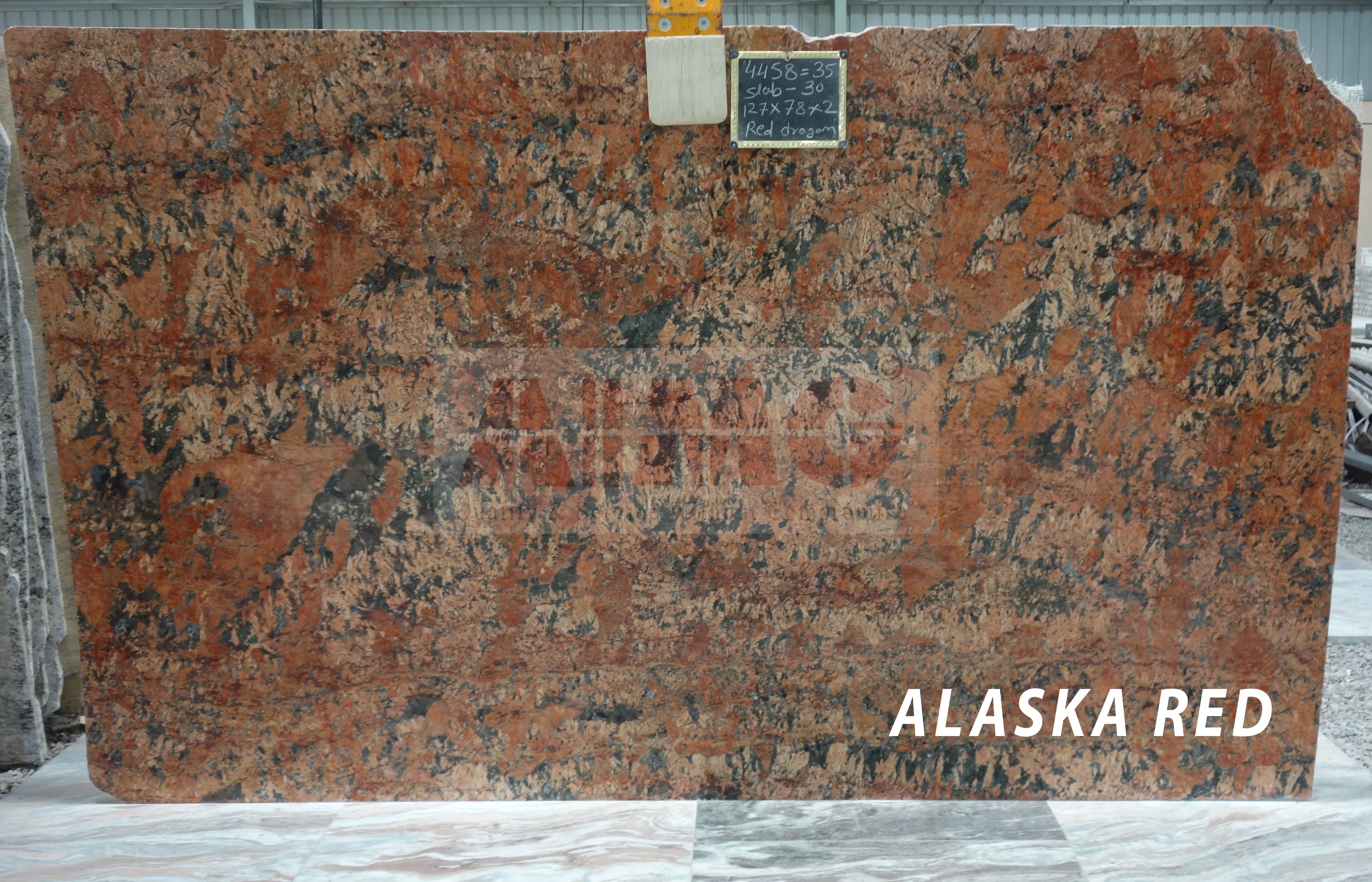 Alaska Red Granite slab by Aravali Marbles featuring bold red and black natural patterns for premium kitchen countertops