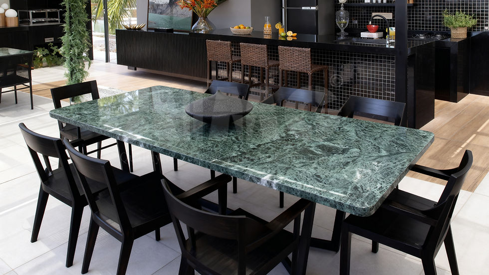 Green marble dining table by Aravali Marbles with polished surface and contemporary setting