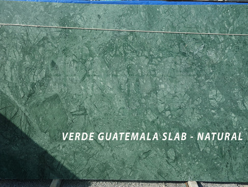 Close-up of Verde Guatemala marble slab showcasing rich green texture and natural white veins