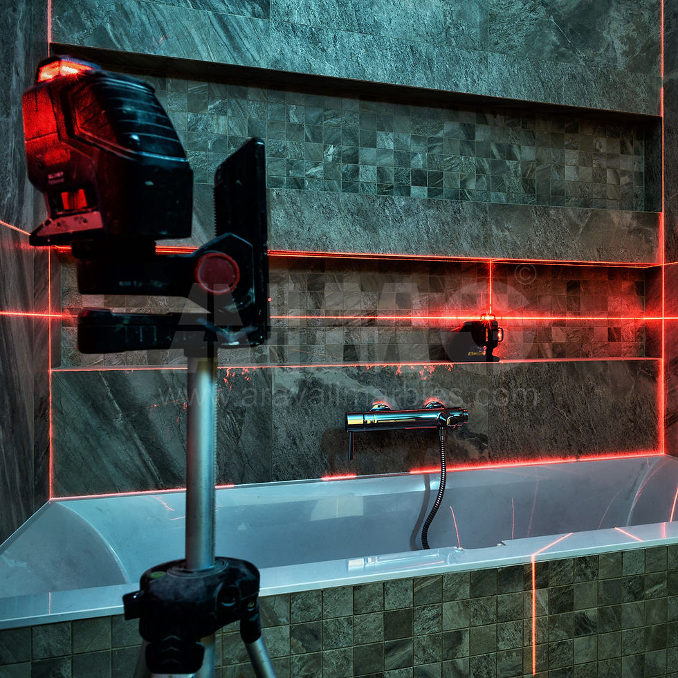 Bathroom under installation with Verde Guatemala Marble wall cladding aligned using laser tools — Aravali India Marbles & Granites