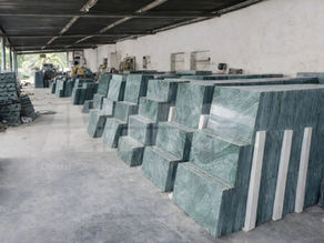 Bulk inventory of Verde Guatemala marble slabs in storage facility by Aravali marbles