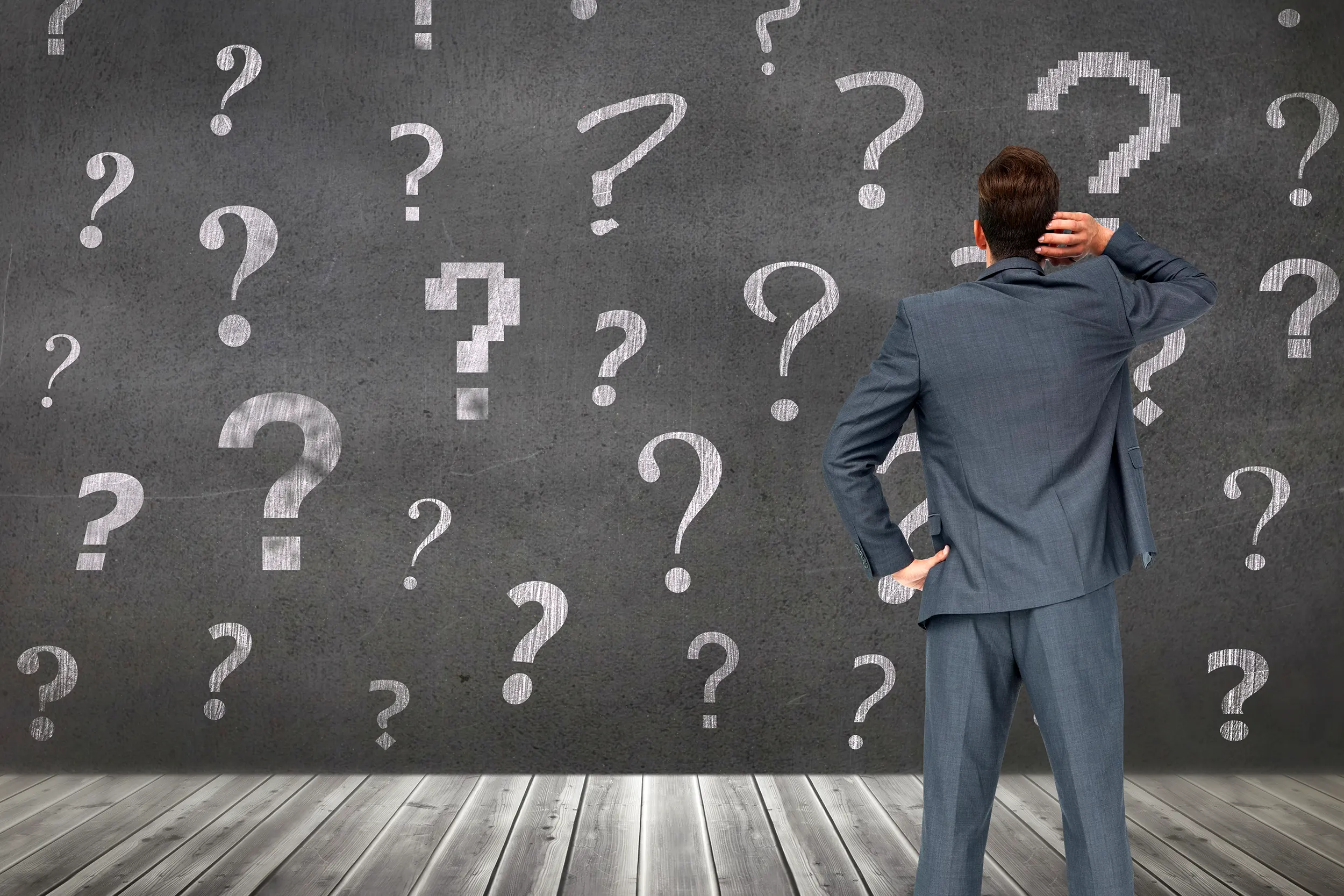 pensive-man-with-question-marks-background.webp